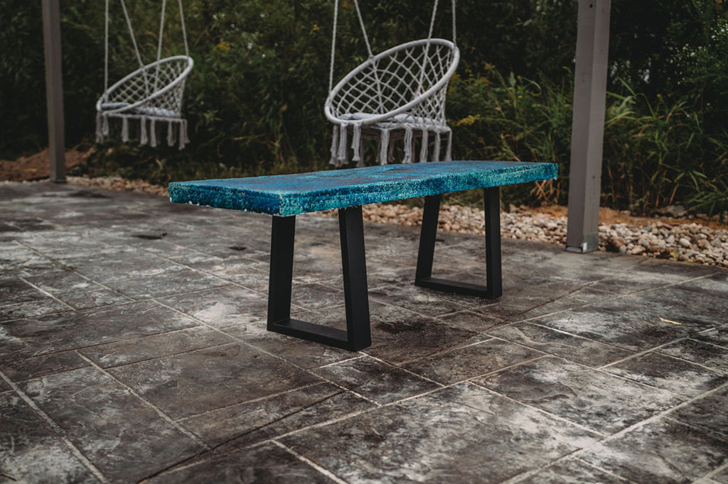 close up of blue concrete bench