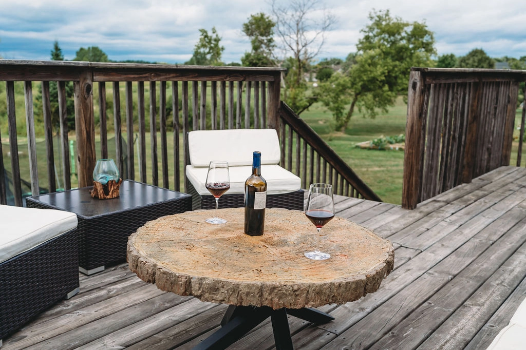 concrete table with wine and wine glass